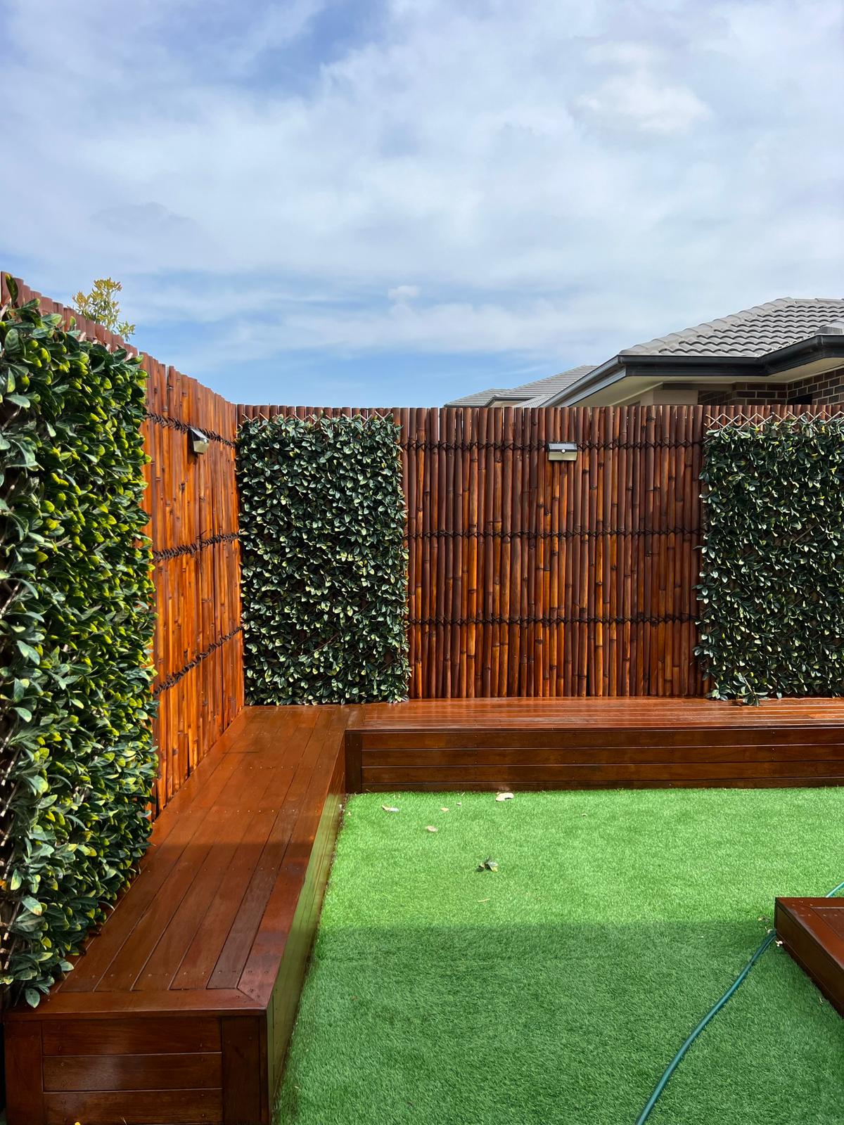 Stone retaining wall construction for sloped garden in Melbourne